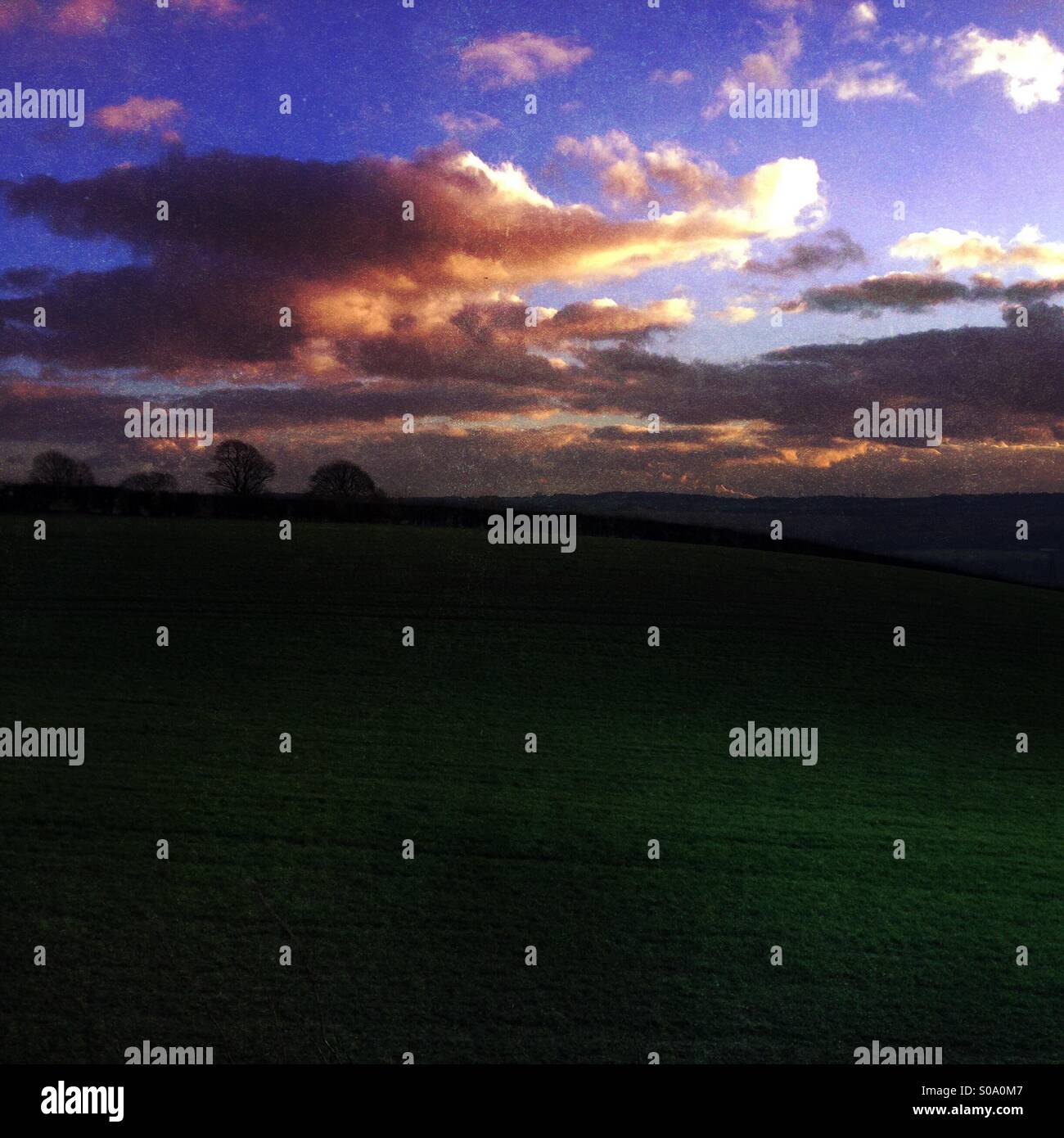 Sunset over English farmland fields Stock Photo