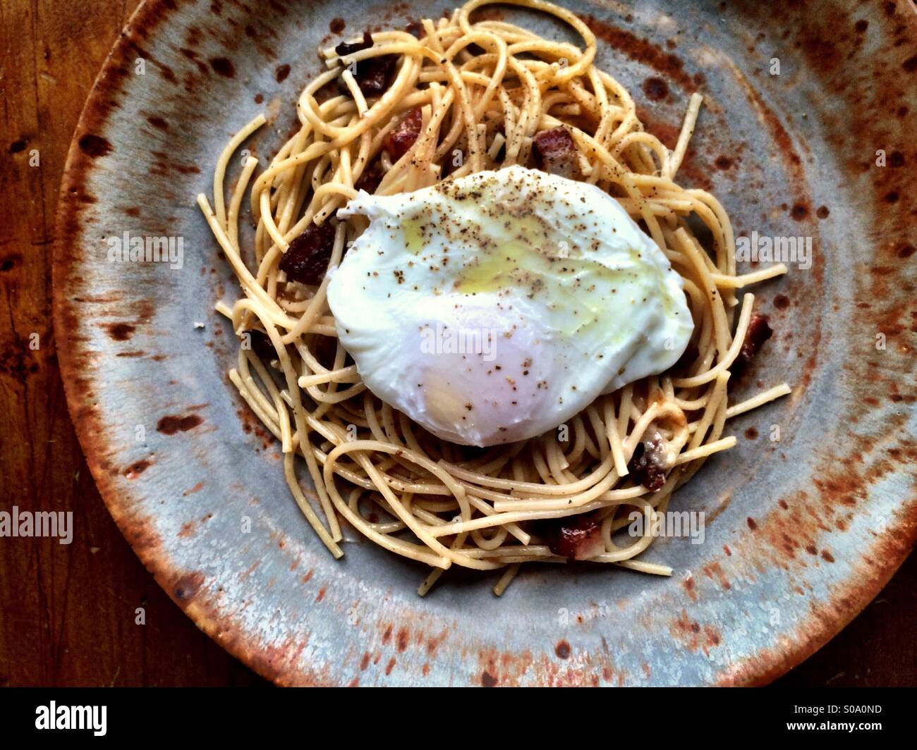 Spaghetti carbonara with a poached - Smartphone Captured Stock Image