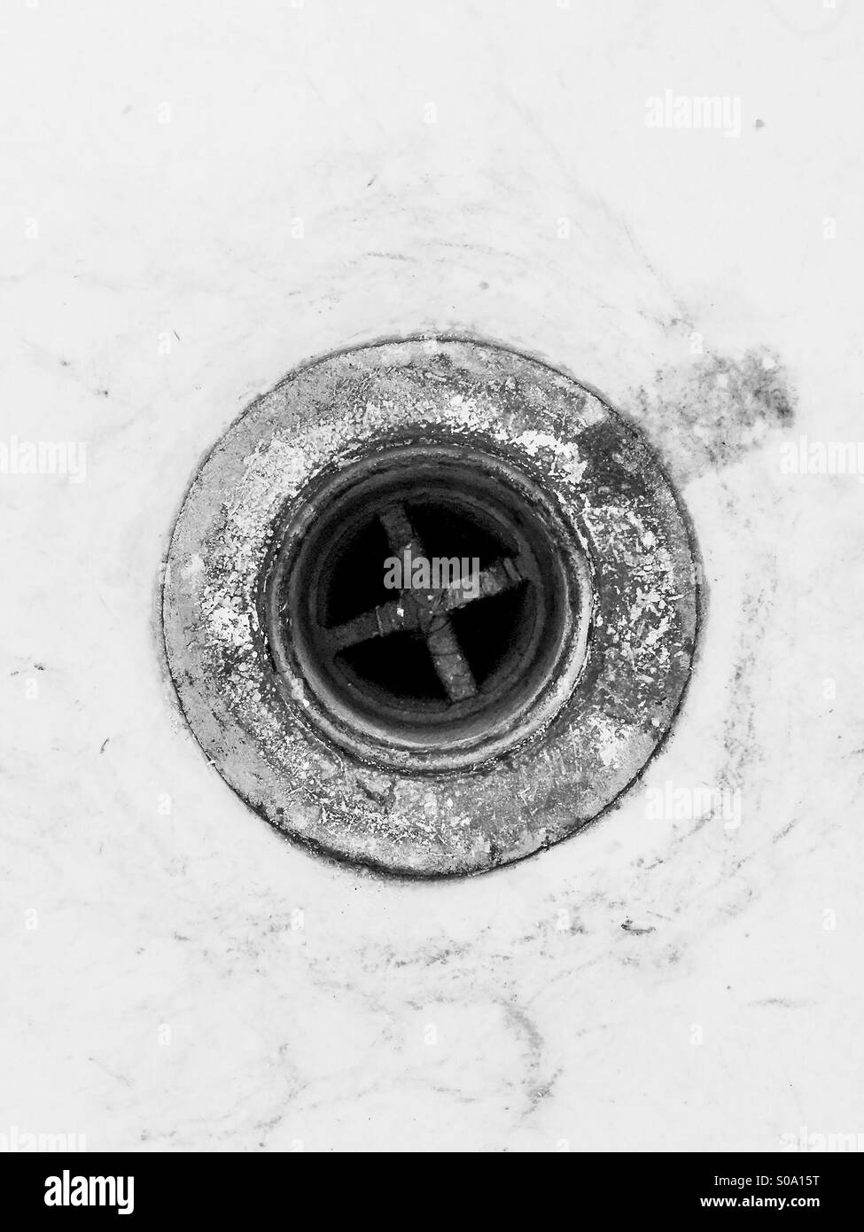 A drain hole in a sink. Stock Photo