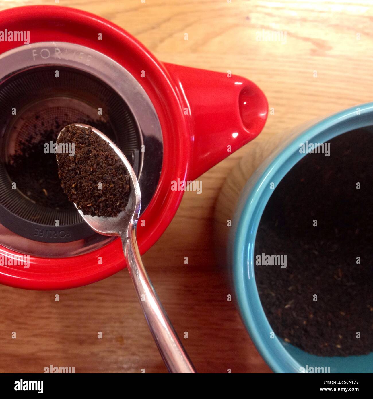 Colourful teapot and jar, making a pot of tea Stock Photo Alamy