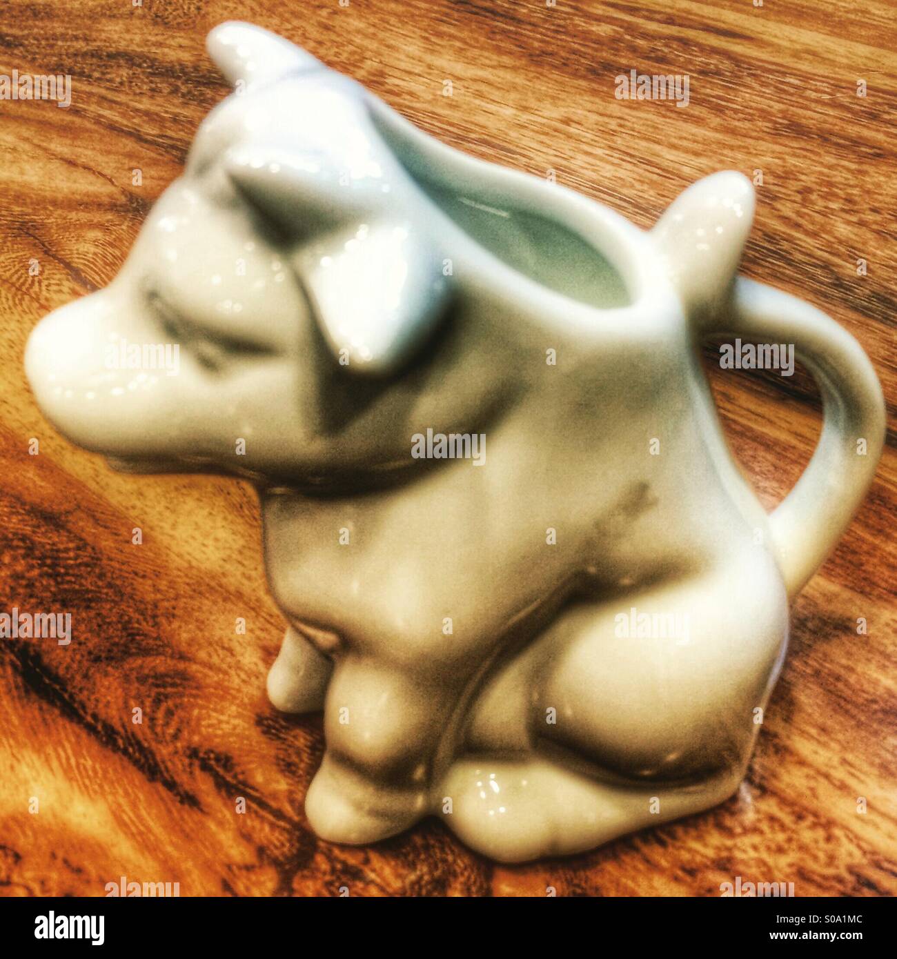 A milk pouring vessel shaped like a cow - Smartphone Captured Stock Image