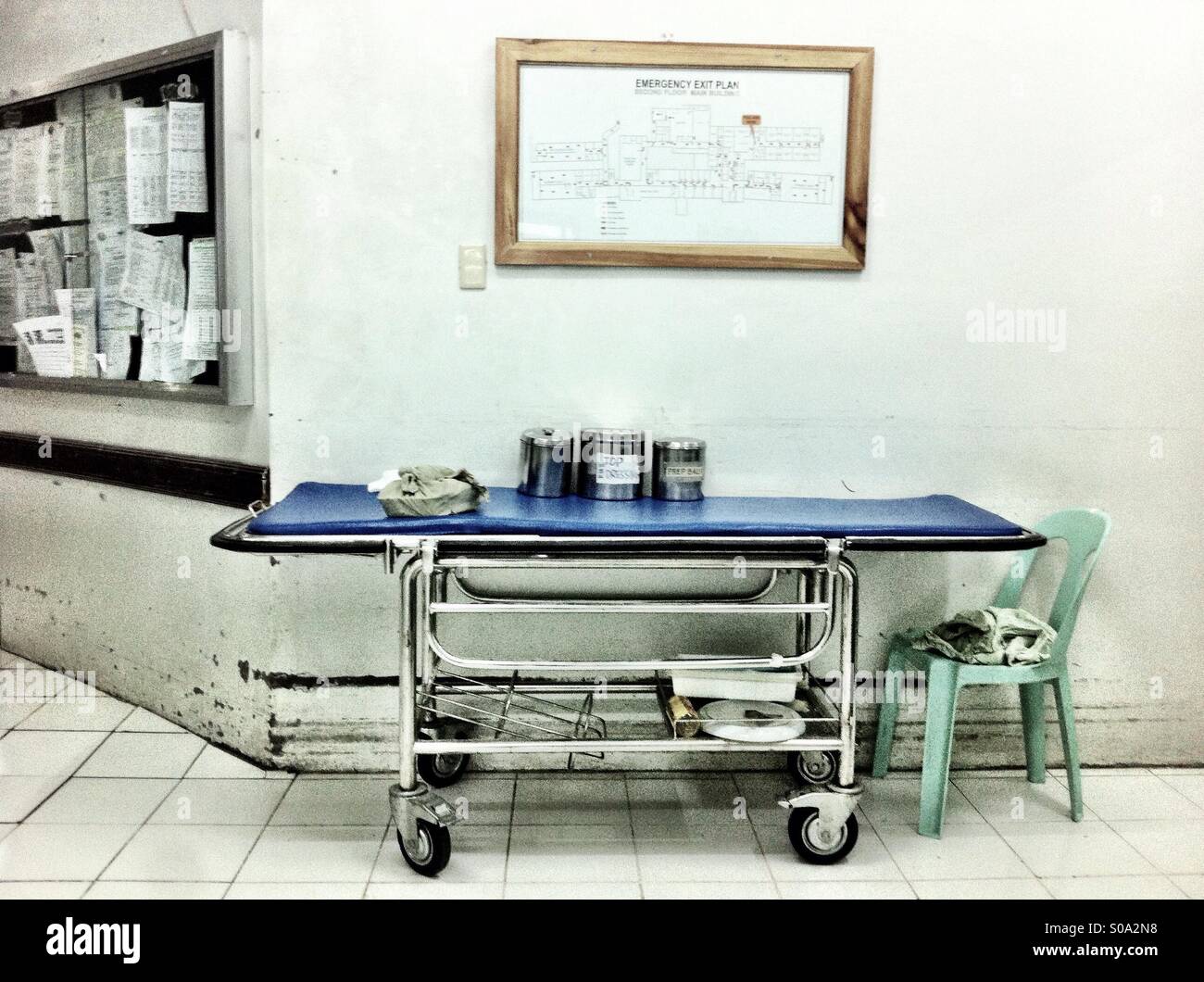 Old hospital bed on wheels in the hallway of the hospital in the