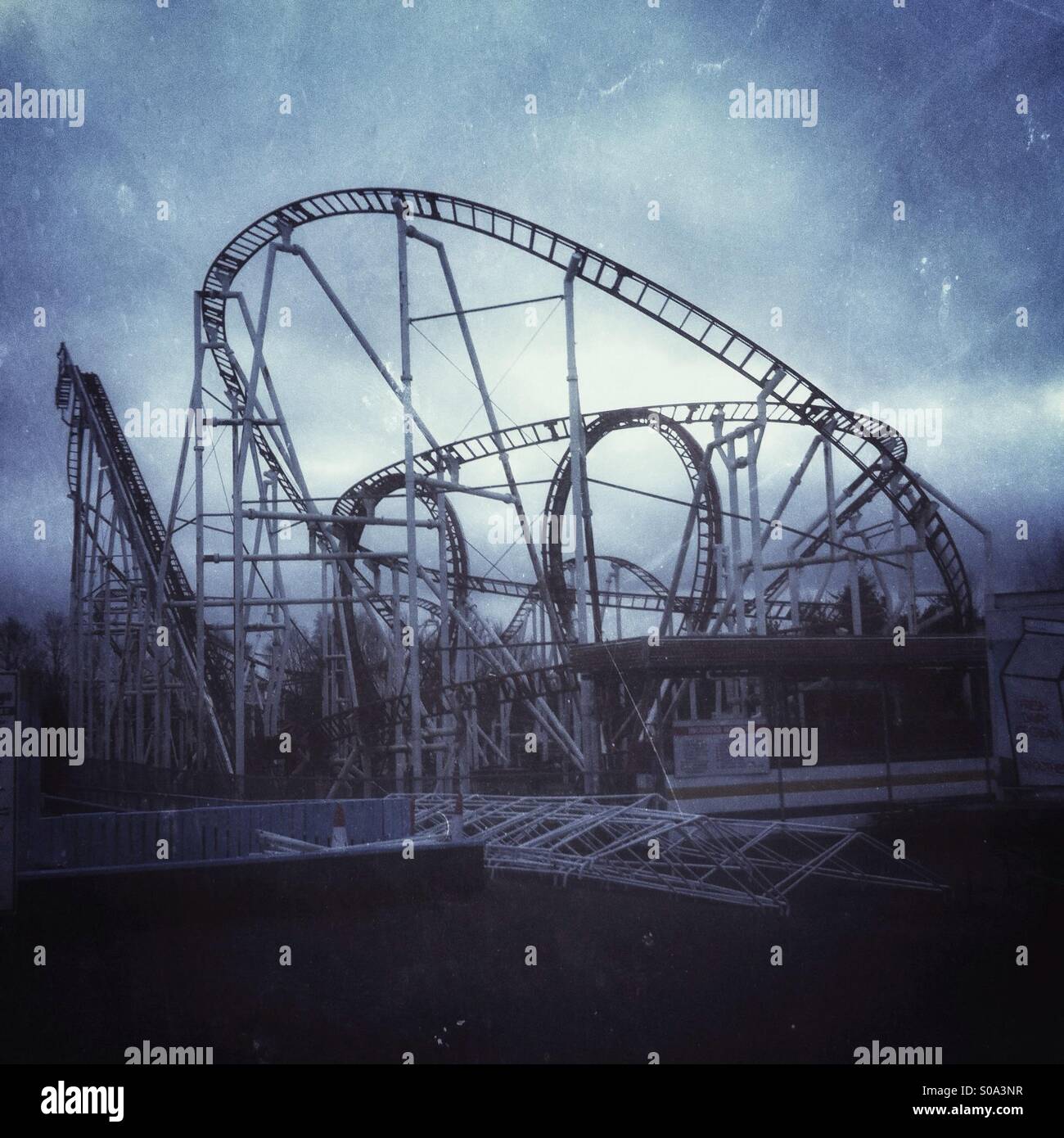 Deserted roller coaster at fairground in winter. - Smartphone Captured Stock Image
