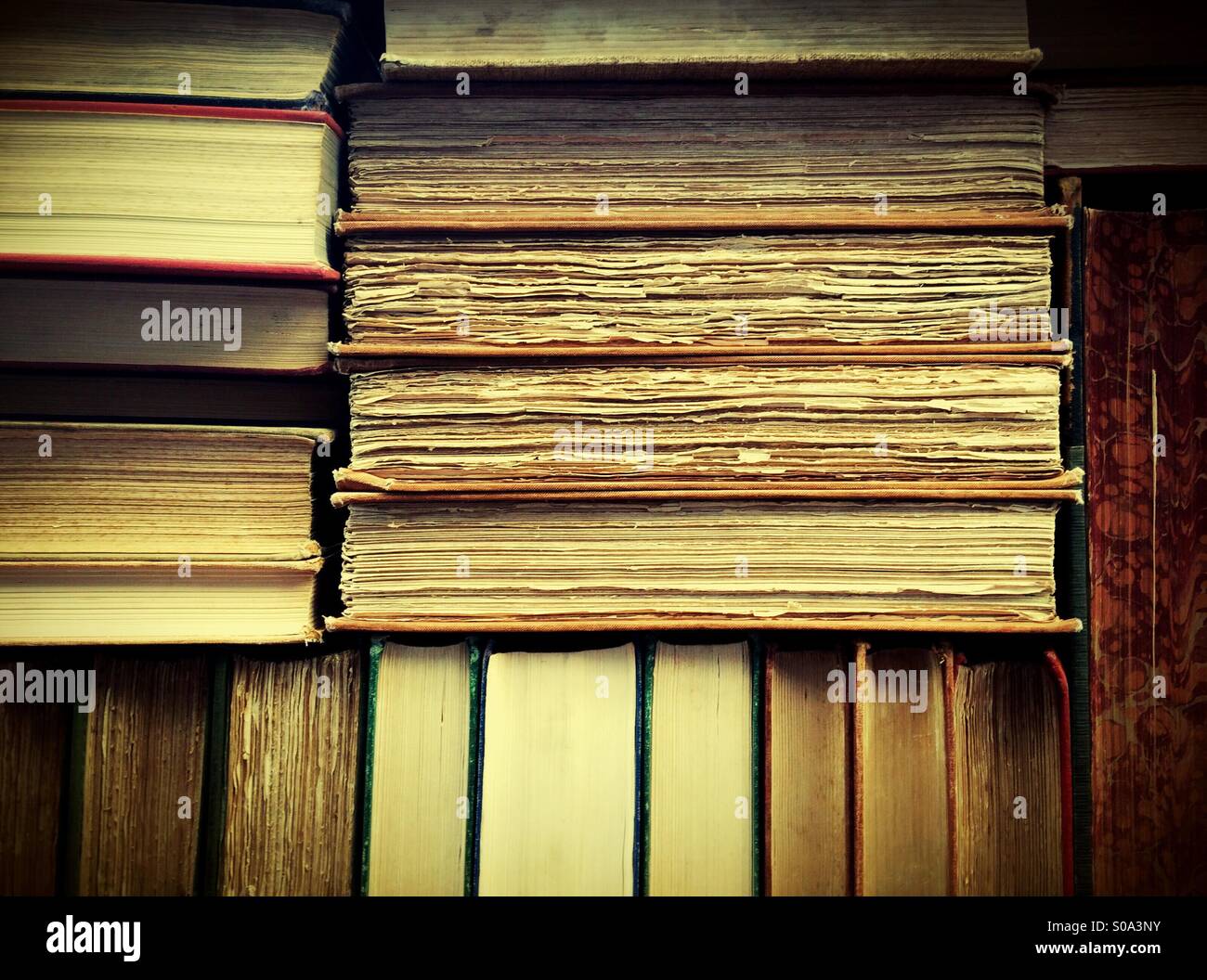 Stack of Vintage Books with Aged Pages – Close-Up View - Smartphone Captured Stock Image