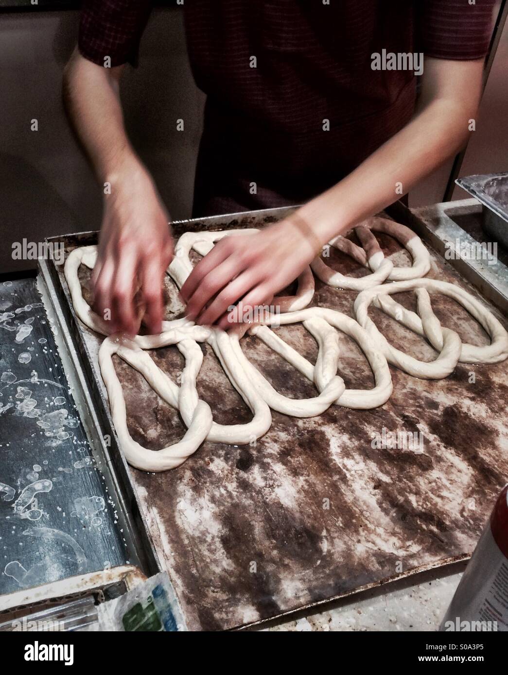 Amish making pretzels  at Reading Terminal Market, Philadelphia, Pennsylvania - Smartphone Captured Stock Image