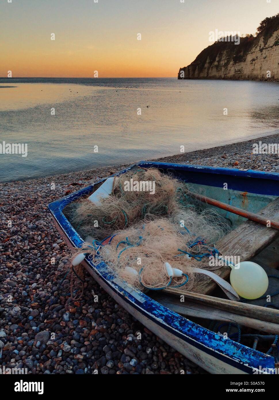 Fishing boat and nets. Fishing village of Beer - Devon, England. Stock Photo