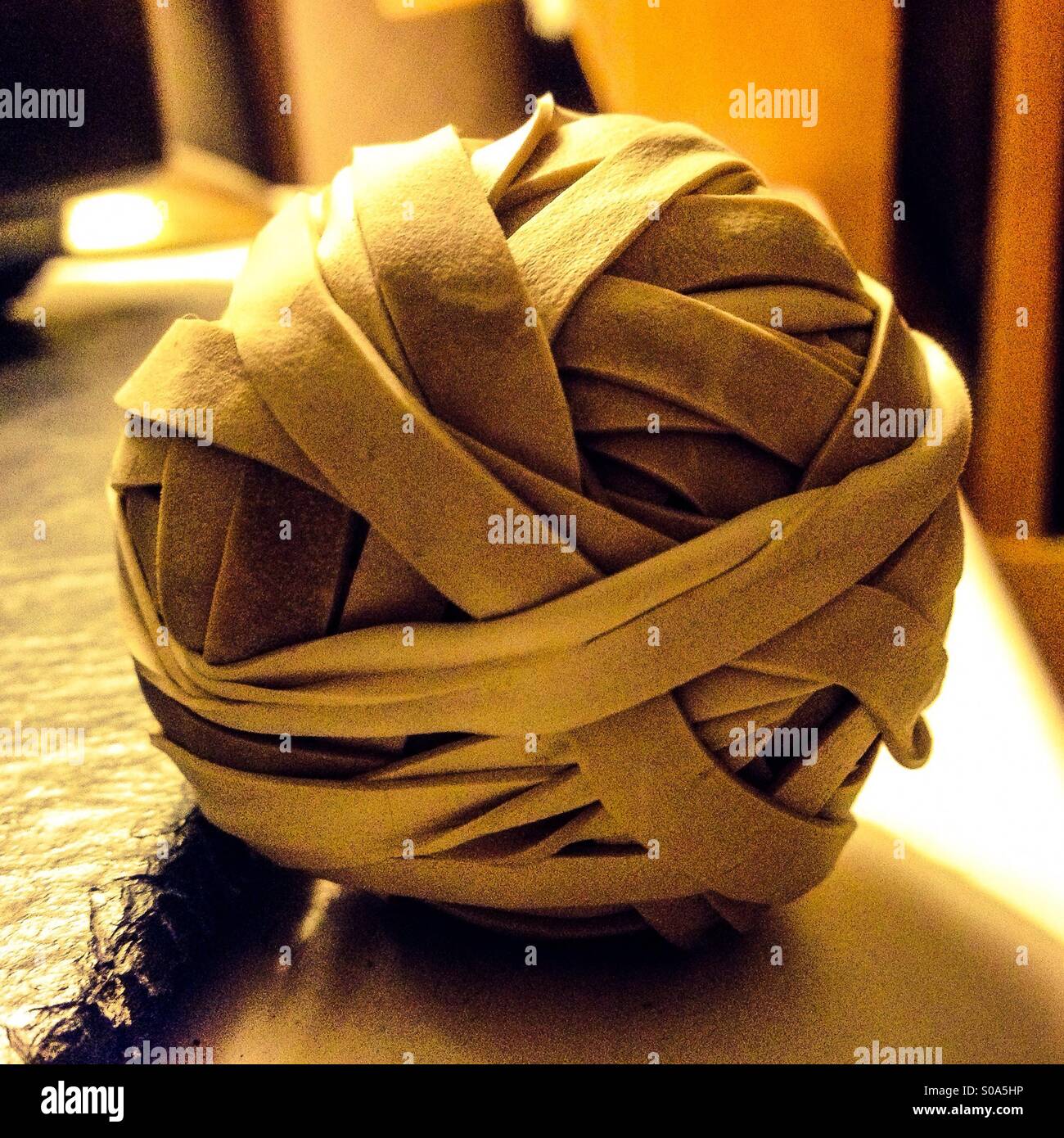 The dark side of a rubber band ball Stock Photo