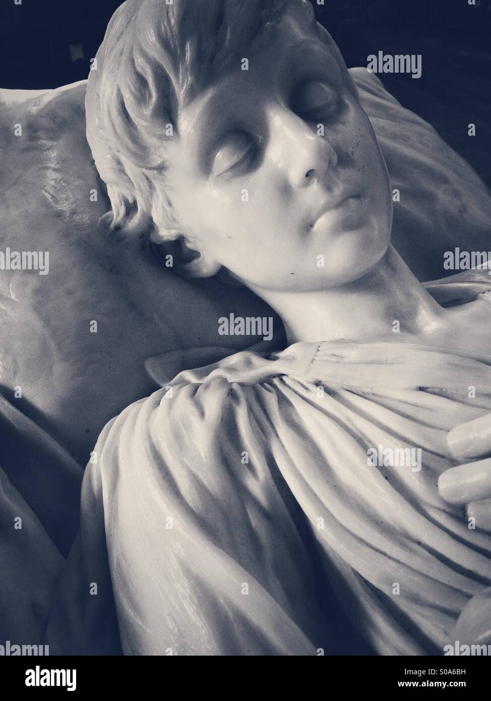 Marble effigy of Robert Charles John Manners, son of the 8th Duke of Rutland, who died in 1894, aged 9. Sited in the chapel at Haddon Hall, Bakewell, Derbyshire, England. Stock Photo