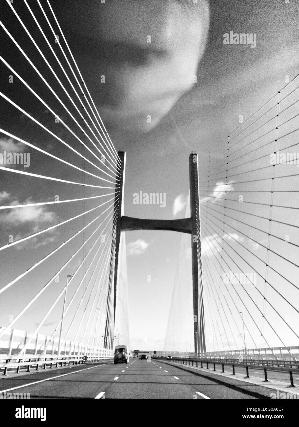 Black and white image of the Severn bridge crossing traveling from Wales to England in the UK - Smartphone Captured Stock Image