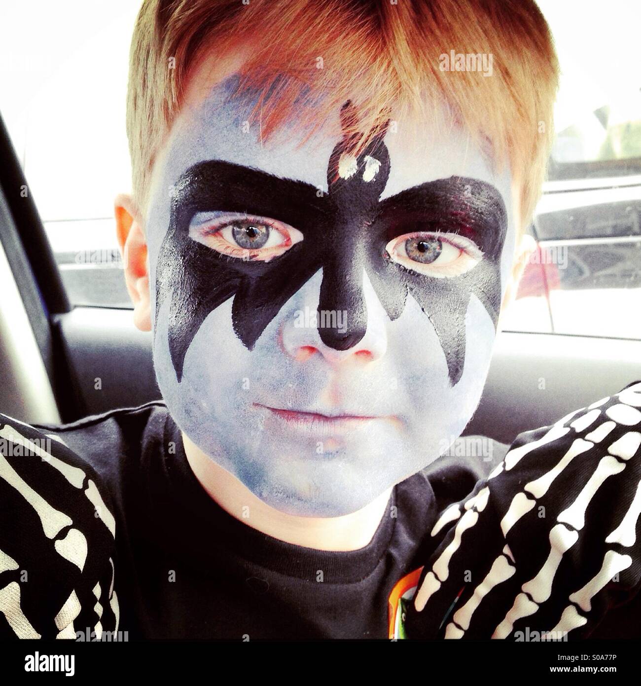 Face painting. Boy with face painted as Batman Stock Photo - Alamy