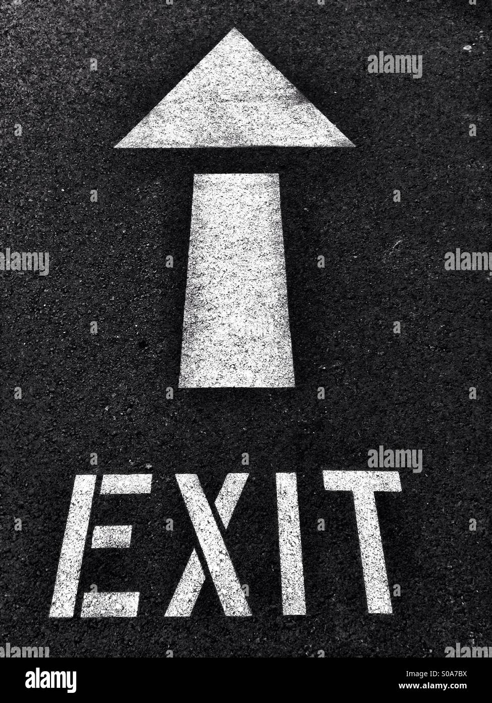 Exit sign and arrow on pavement - Smartphone Captured Stock Image
