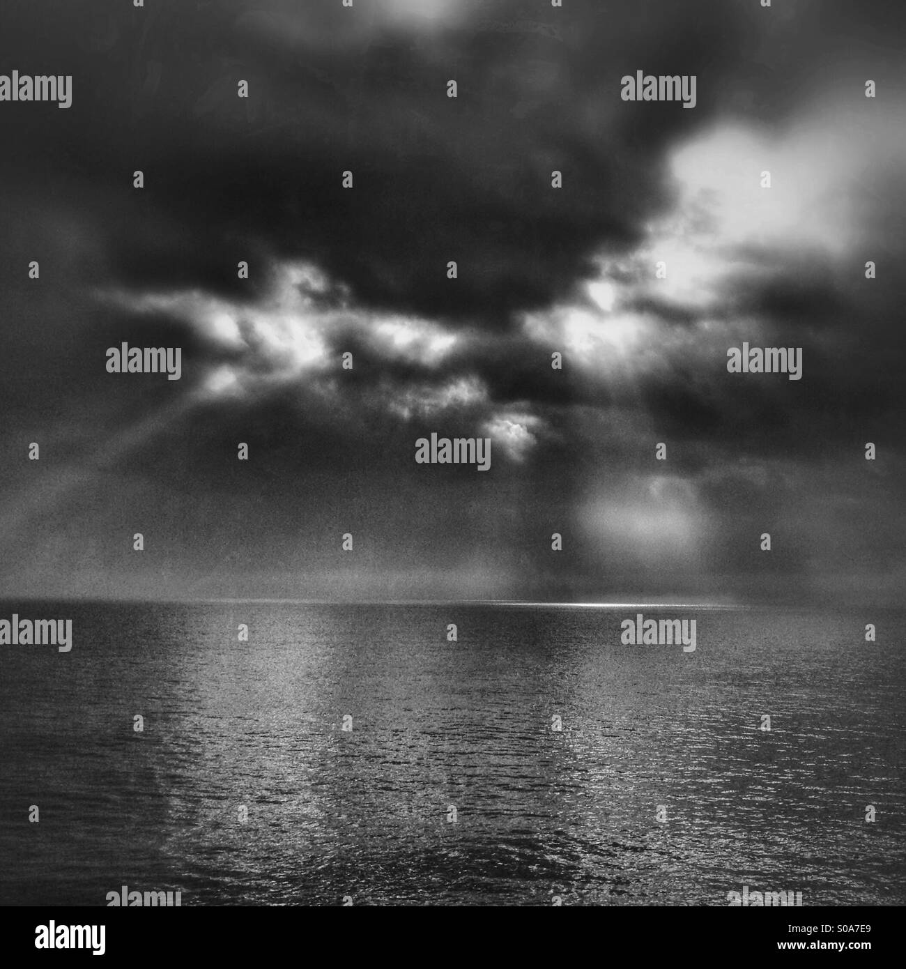 Sun rays breaking through dark clouds - Smartphone Captured Stock Image