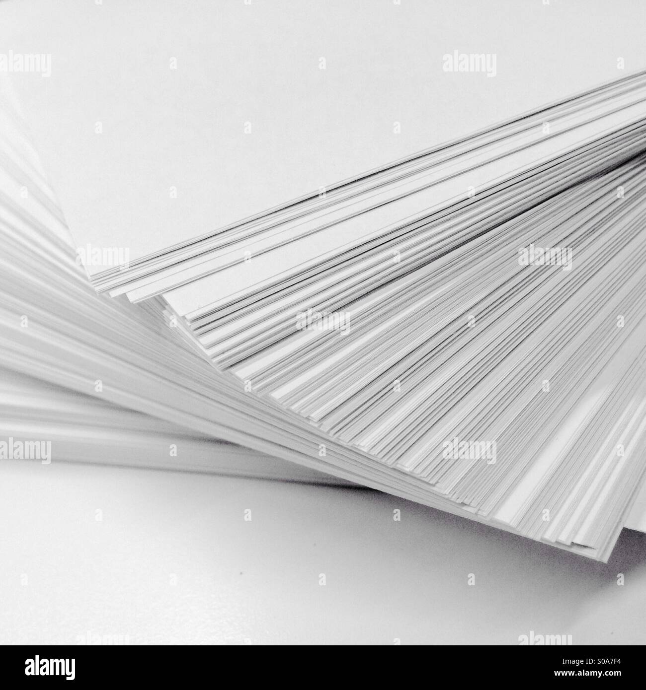 Ream of white paper on white background Stock Photo Alamy
