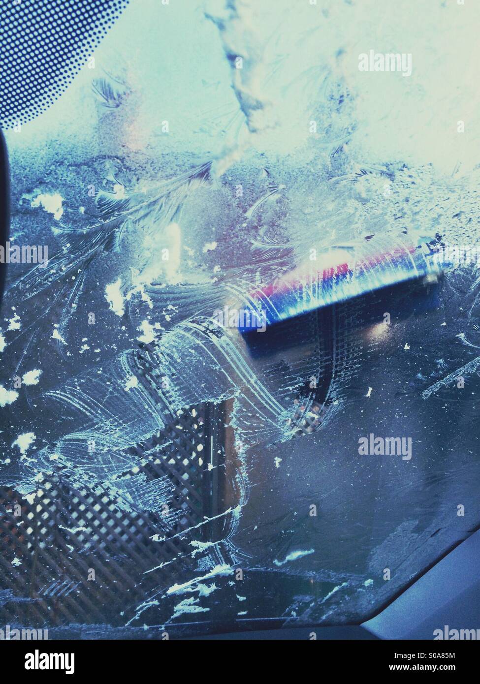 I've scraping a car windscreen Stock Photo