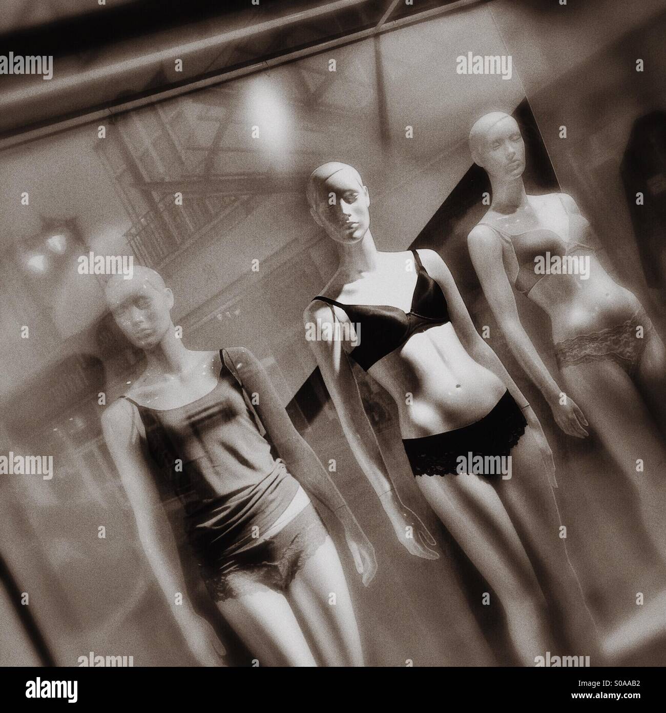 Mannequins in shop window Stock Photo