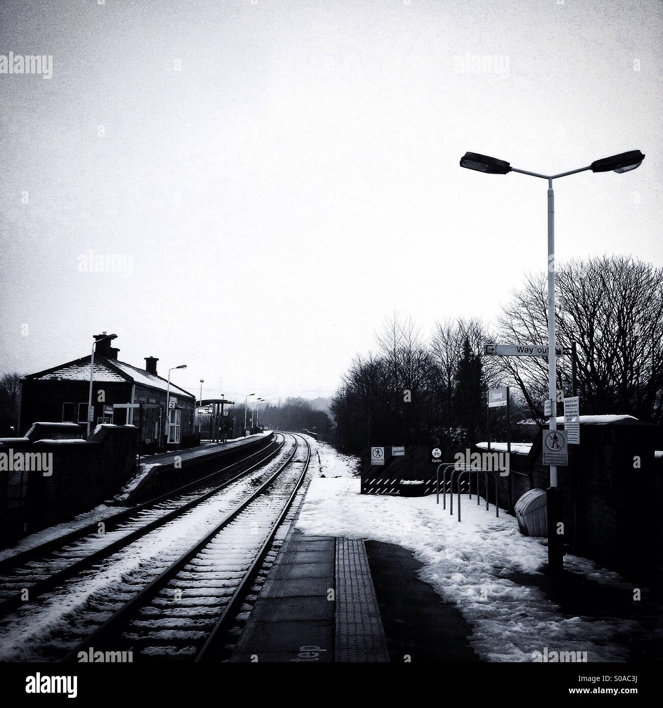 Snow on the rail tracks at Littleborough train station, England. Stock Photo