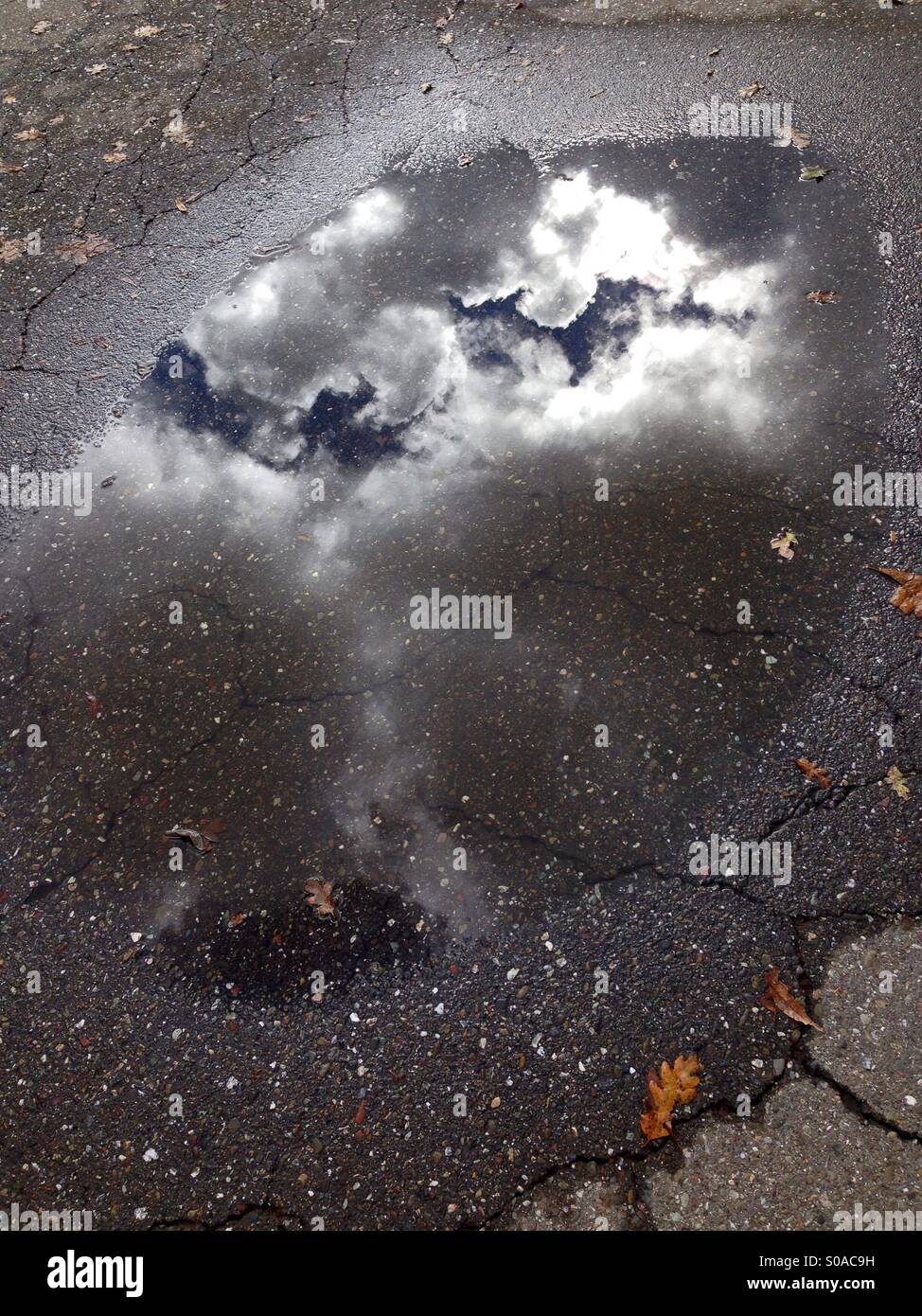 Cloud reflection in a pool of water - Smartphone Captured Stock Image