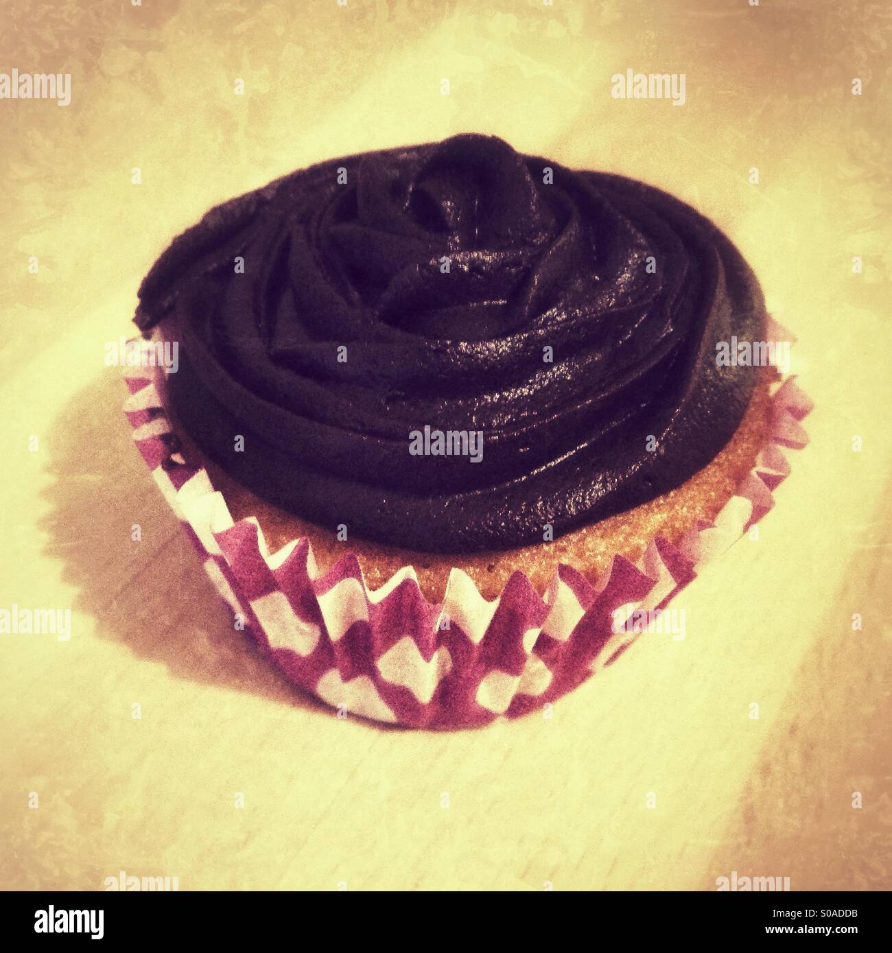 Chocolate fairy cake on a wooden background and - Smartphone Captured Stock Image