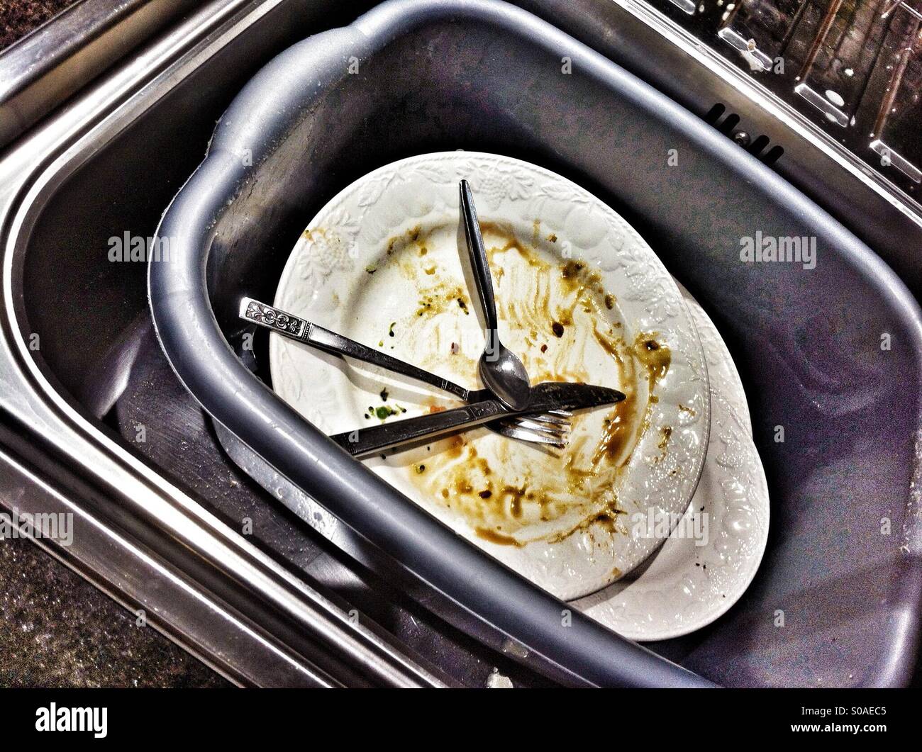 Dirty dishes in washing up bowl Stock Photo Alamy