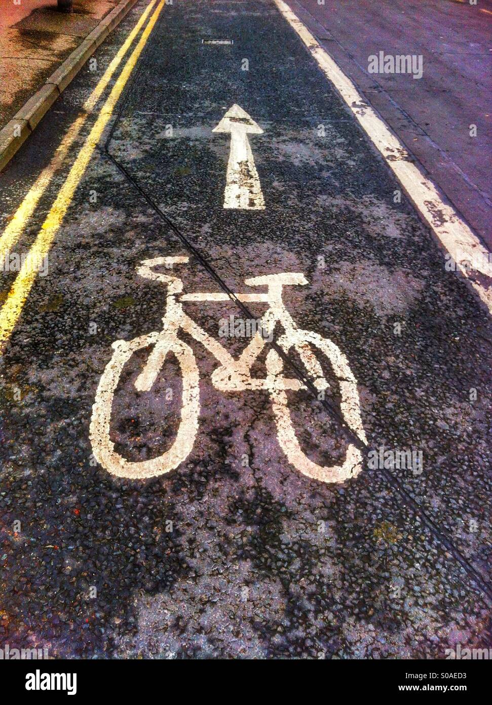 Cycling sign painted on road England UK - Smartphone Captured Stock Image