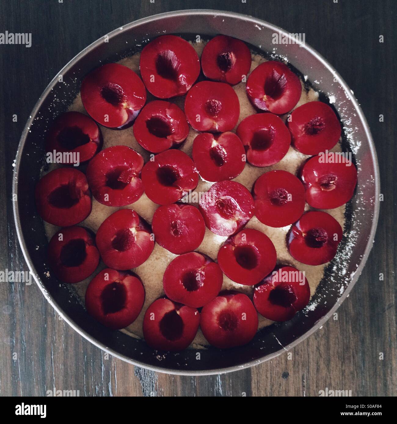 German plum cake ready to go in oven Stock Photo