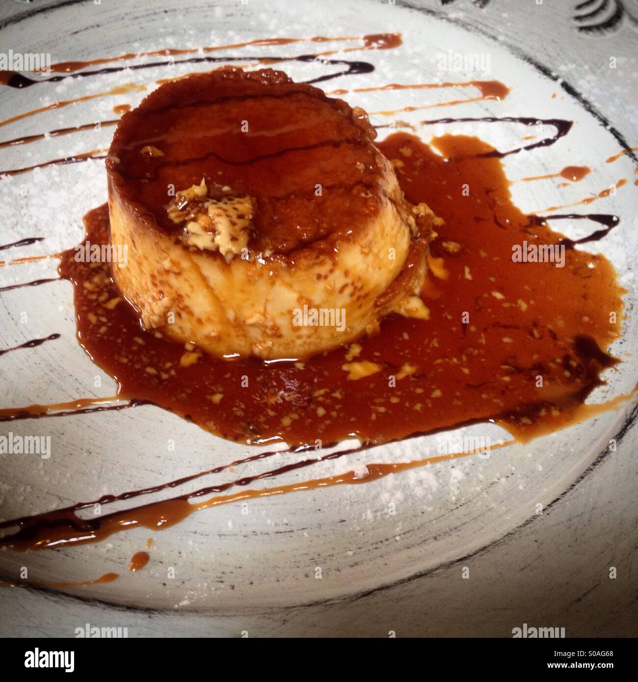 A flan in Beso Huasteco restaurant in Colonia Roma, Mexico City, Mexico - Smartphone Captured Stock Image