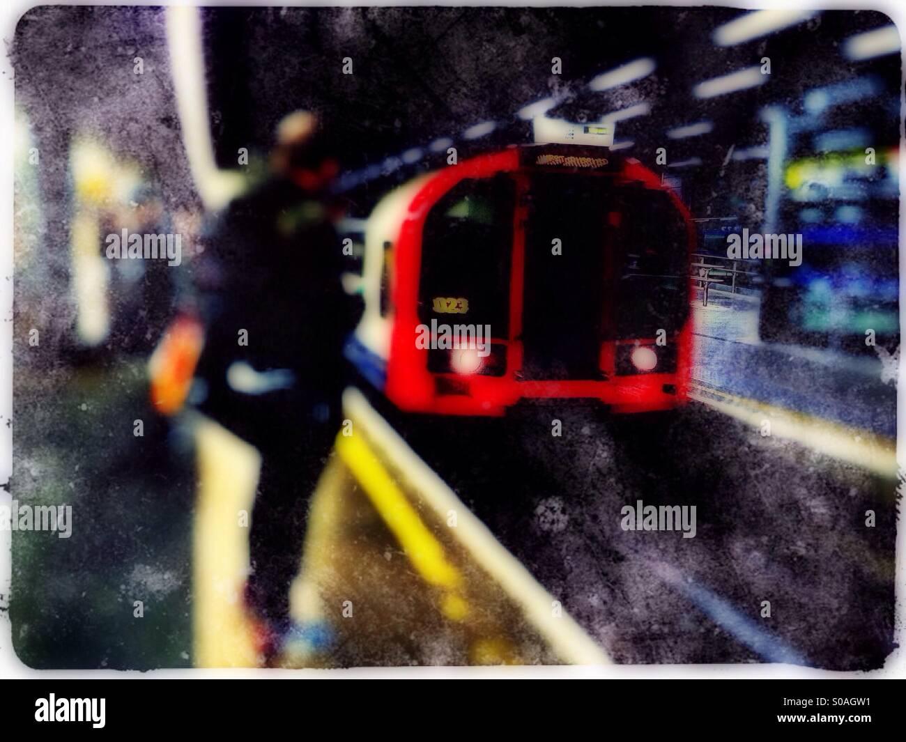 Central Line Tube train approaching platform, Stratford, London, UK