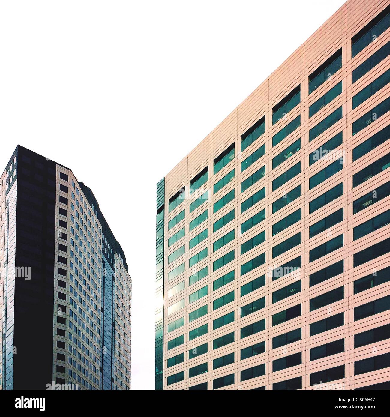 The setting sun glinting off two buildings in the San Fernando valley - Smartphone Captured Stock Image