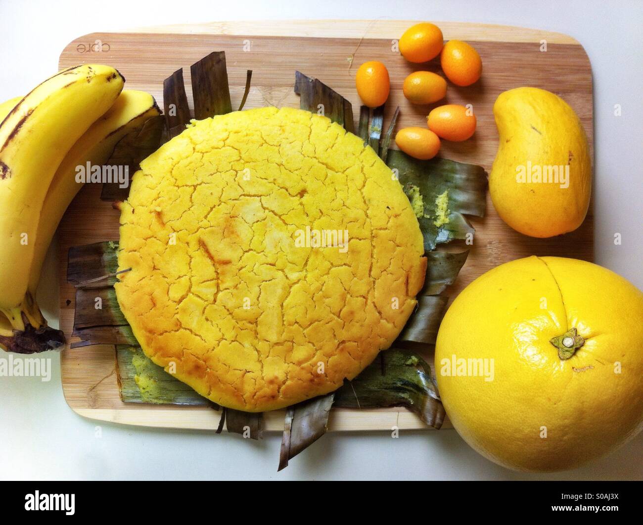 Still life in yellows with traditional Philippine rice cake bibingka Stock Photo