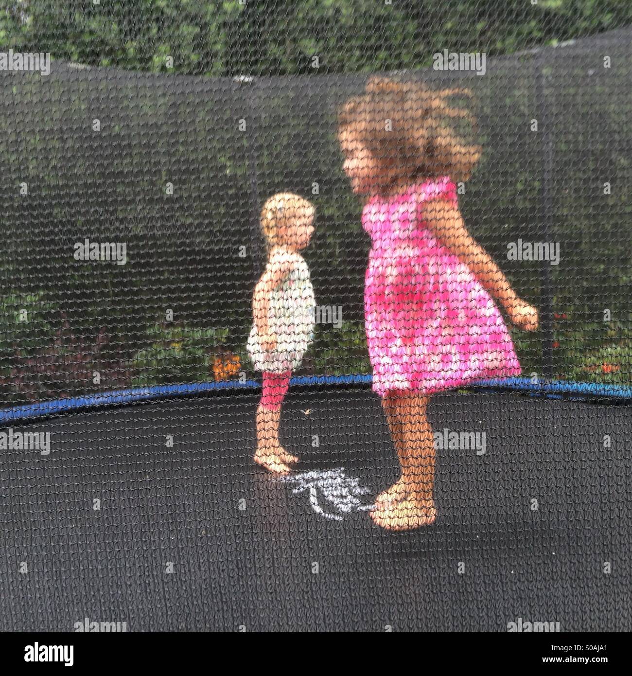 Jumping joy two girls jumping hi-res stock photography and images - Alamy