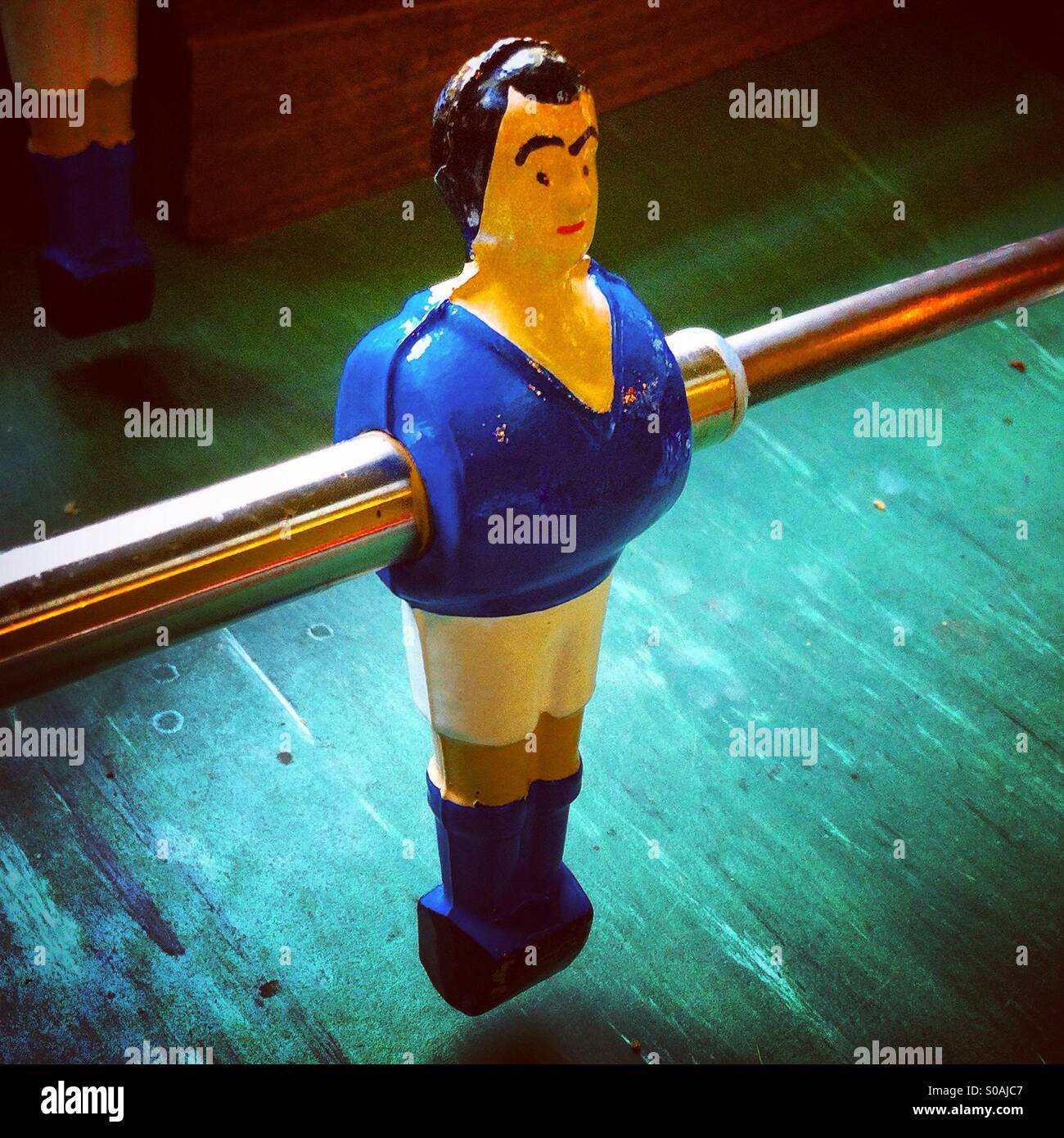 Blue player at the table football or baby-foot - Smartphone Captured Stock Image
