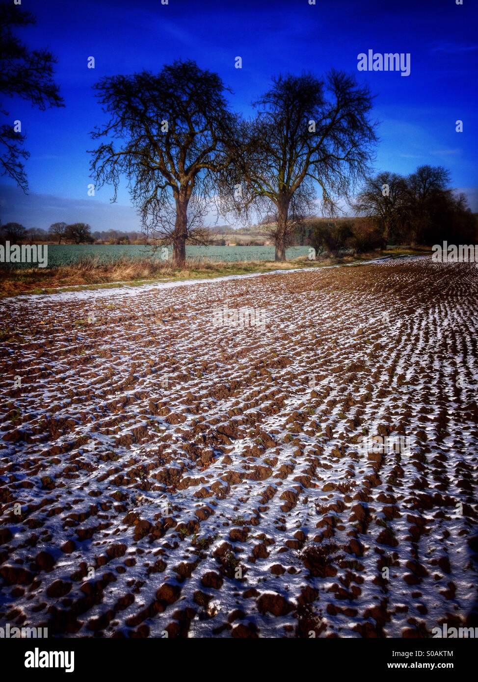 A dusting of snow on a ploughed field. Sudbrook, Lincolnshire, England. - Smartphone Captured Stock Image