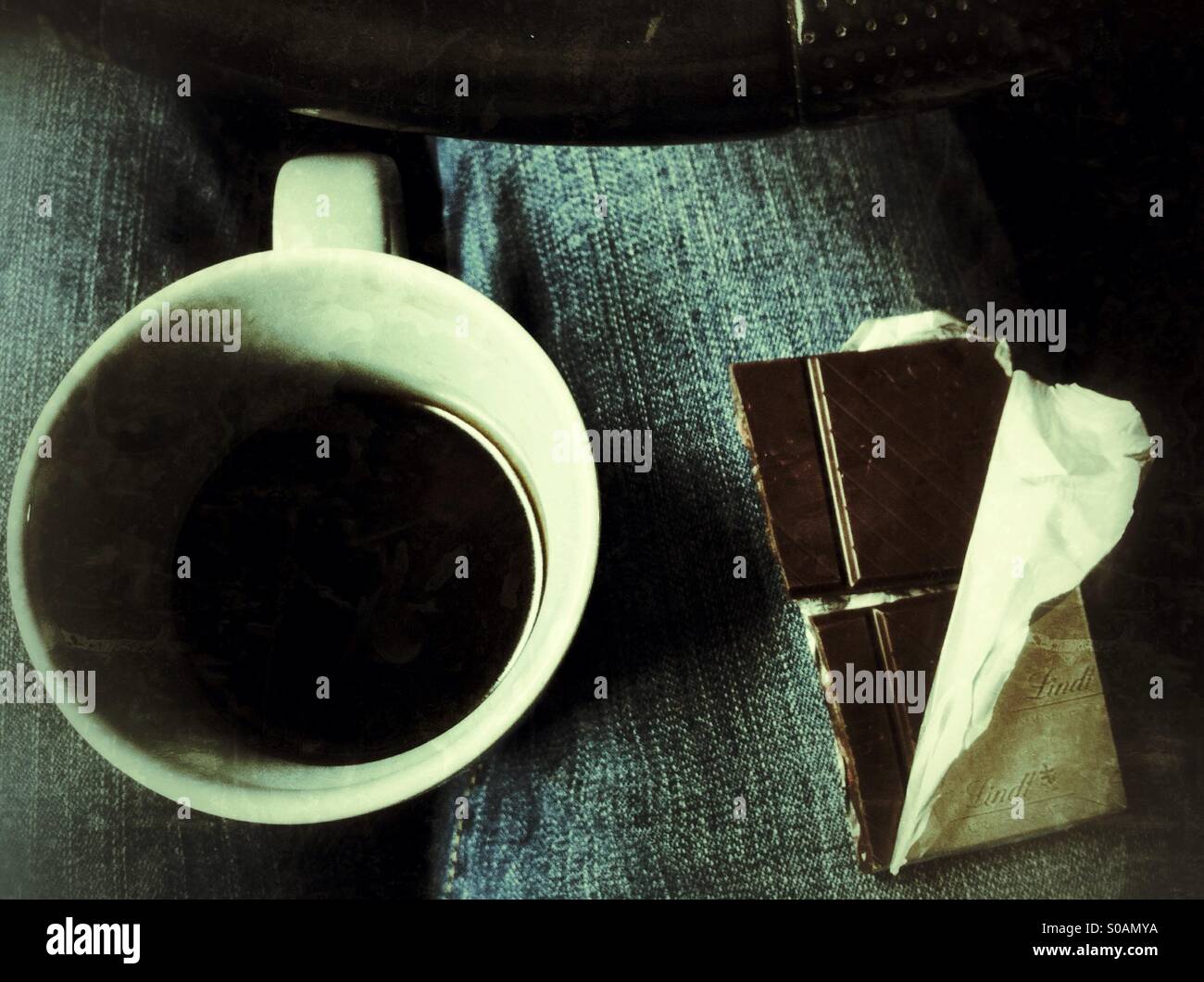 Coffee and chocolate and the steering wheel - Smartphone Captured Stock Image