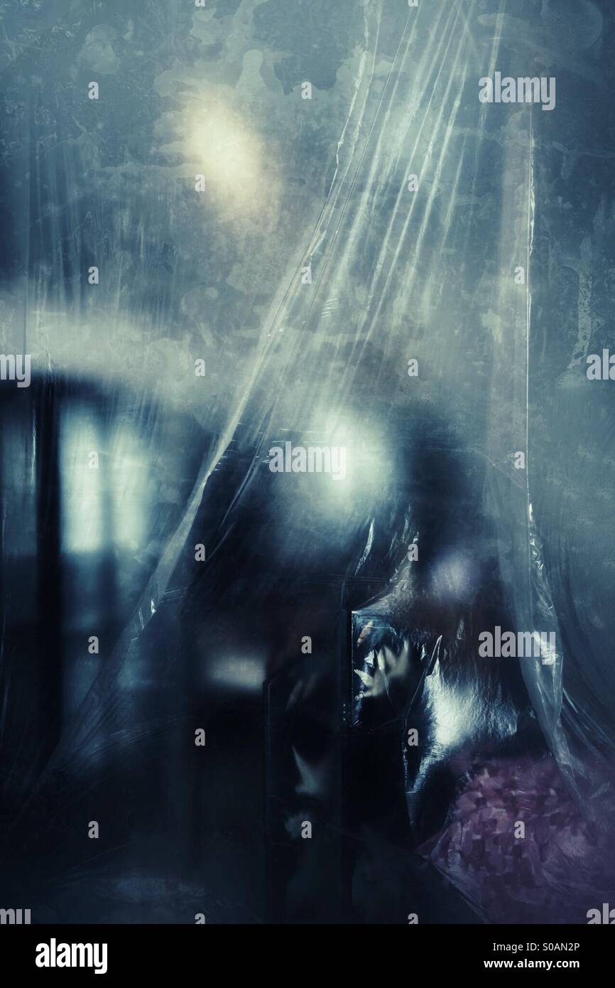 Plastic covered furniture Stock Photo Alamy