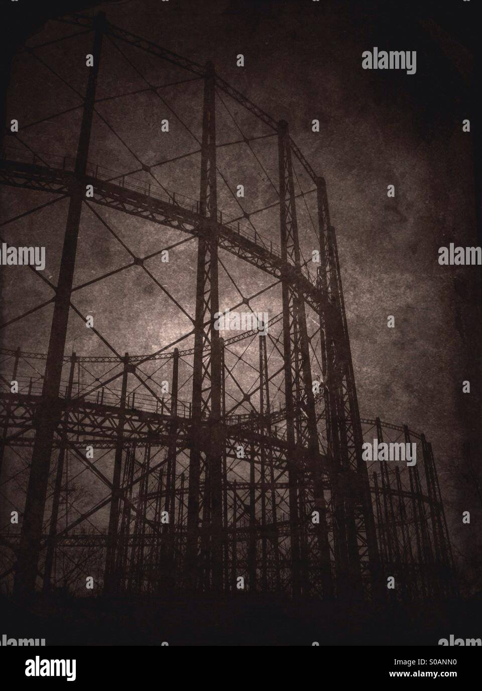Moody black and white photo of gasometer. - Smartphone Captured Stock Image