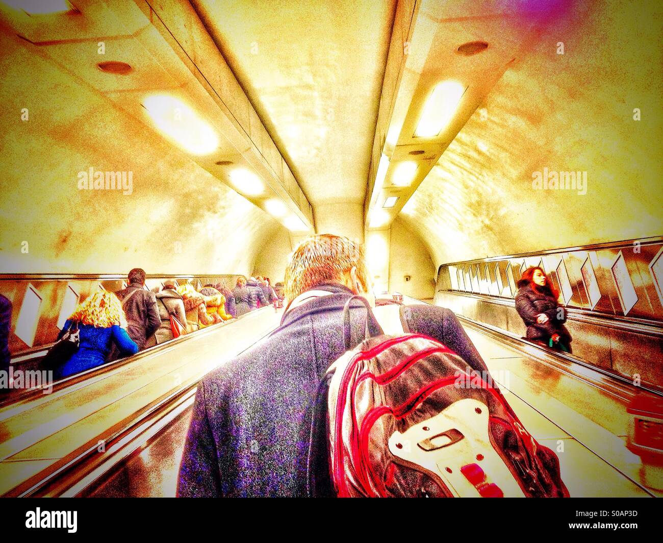 Subway commuters on an escalator - Smartphone Captured Stock Image