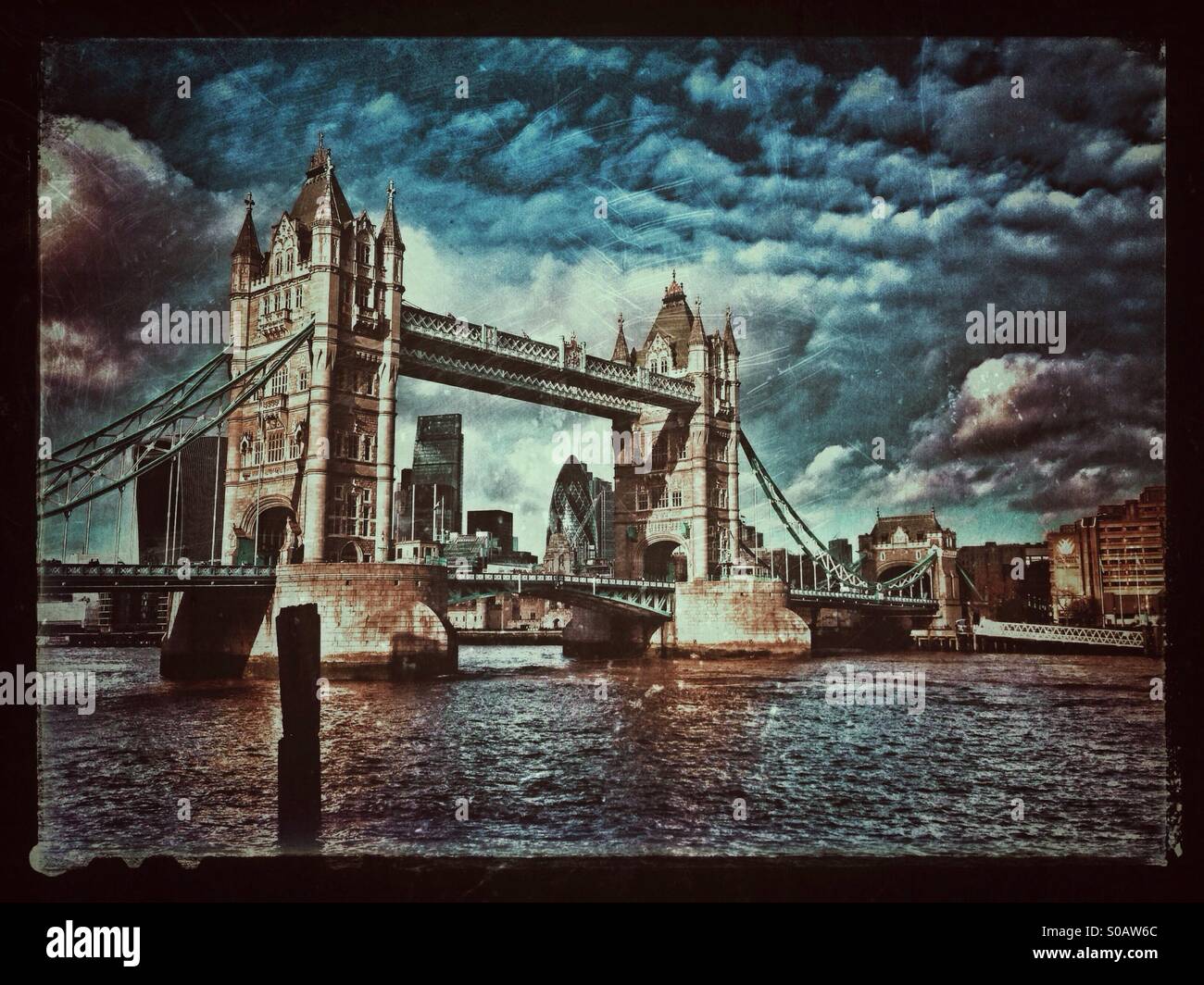 An Antique/Grunge Effect Image of Tower Bridge in London, England. A view from the South Bank of The River Thames. Tower Bridge was constructed between 1886 and 1894. Photo Credit © COLIN HOSKINS - Smartphone Captured Stock Image