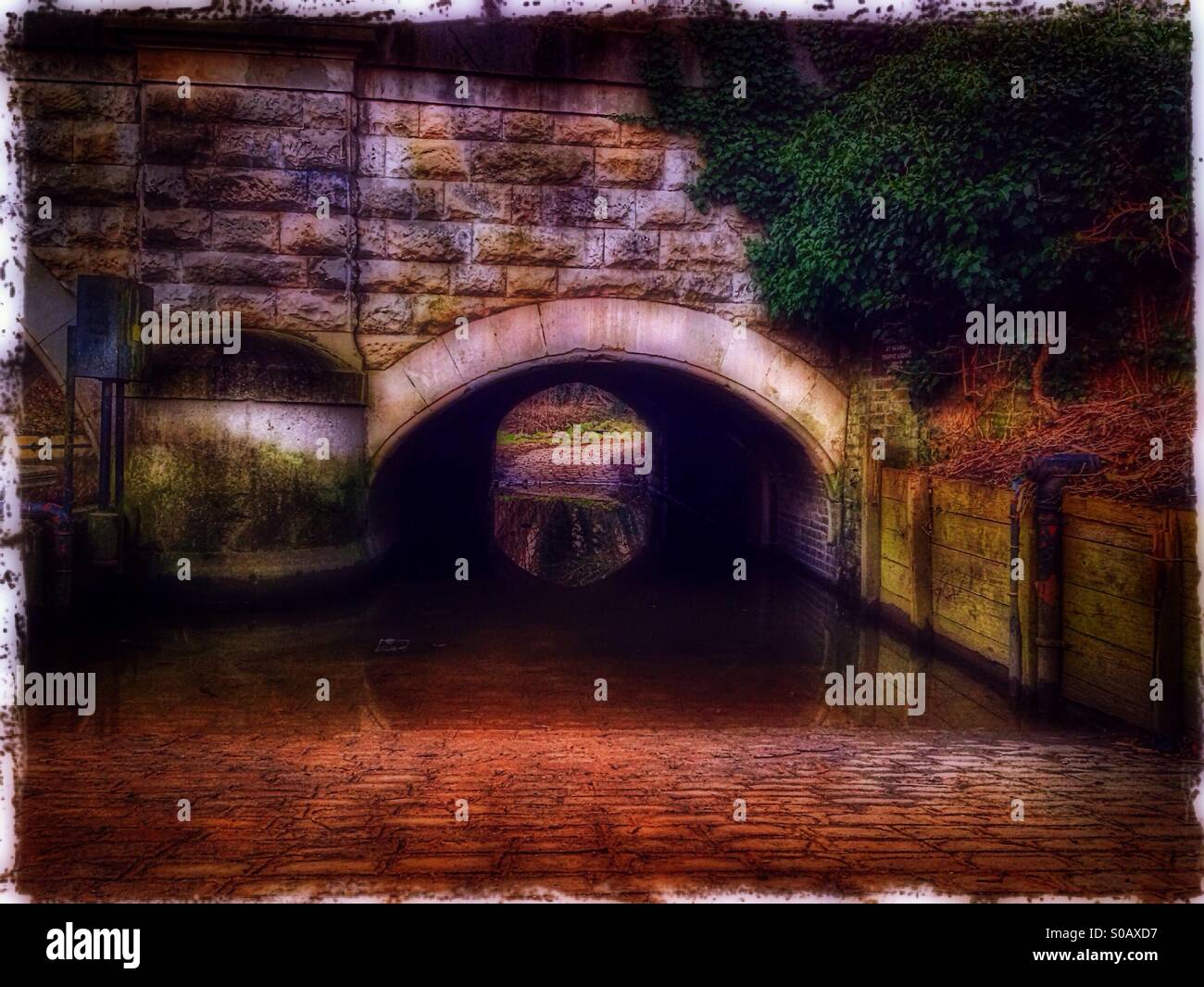 Flooded footpath underneath bridge, Hanwell, London Borough of Ealing
