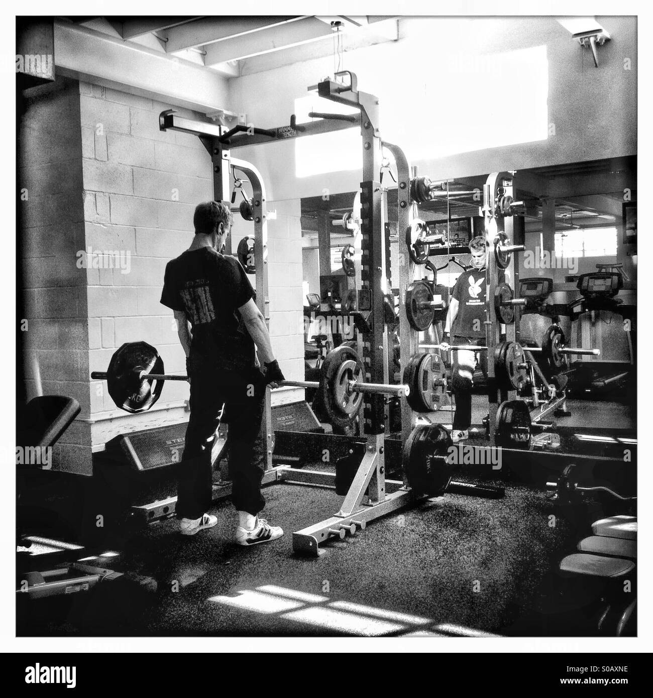 Strength training exercise man gym Black and White Stock Photos