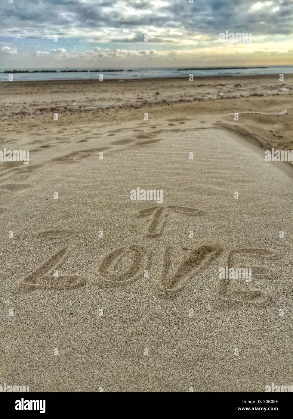 Love message written on the sand Stock Photo