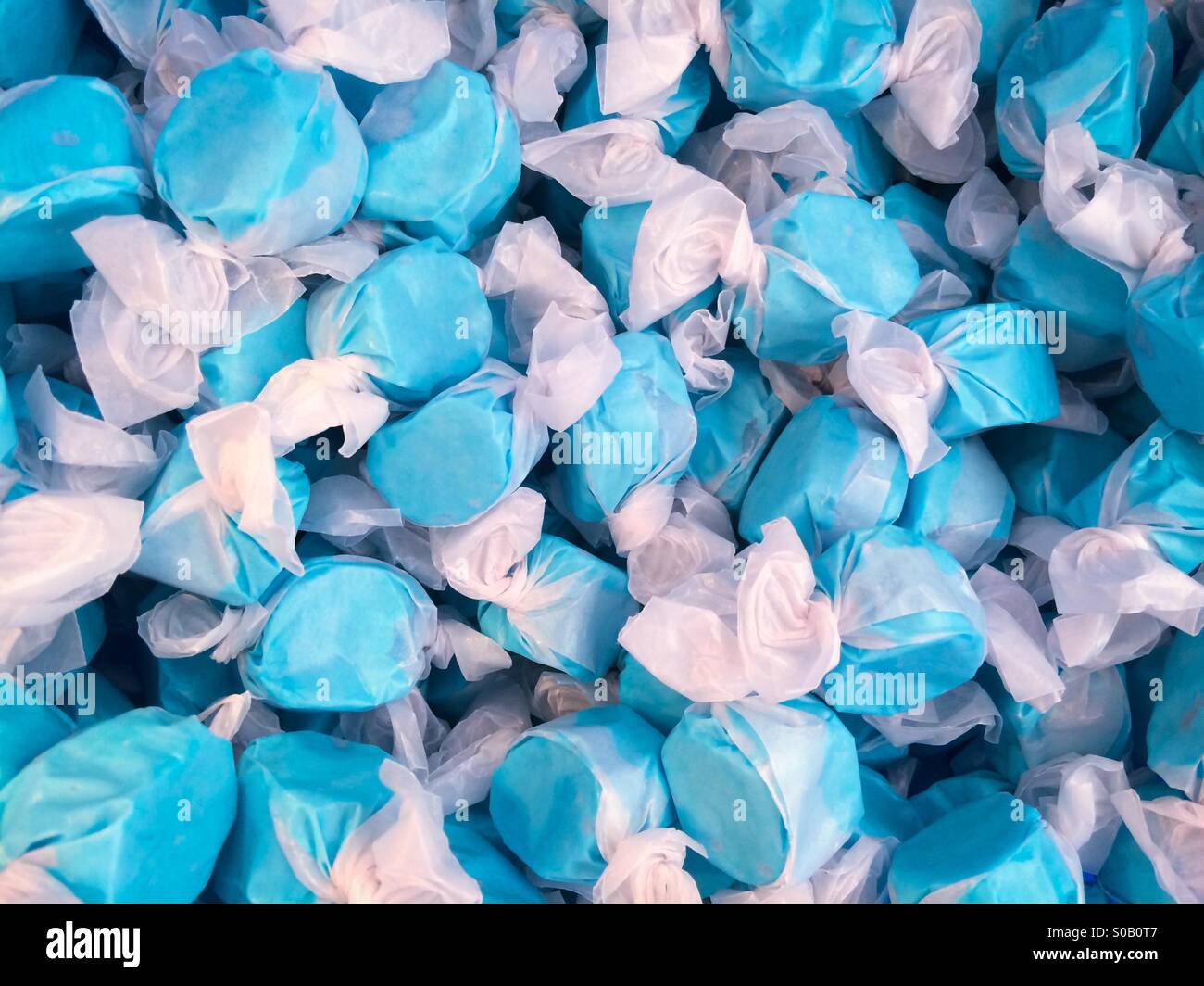 Blue raspberry flavored salt water taffy candy - Smartphone Captured Stock Image