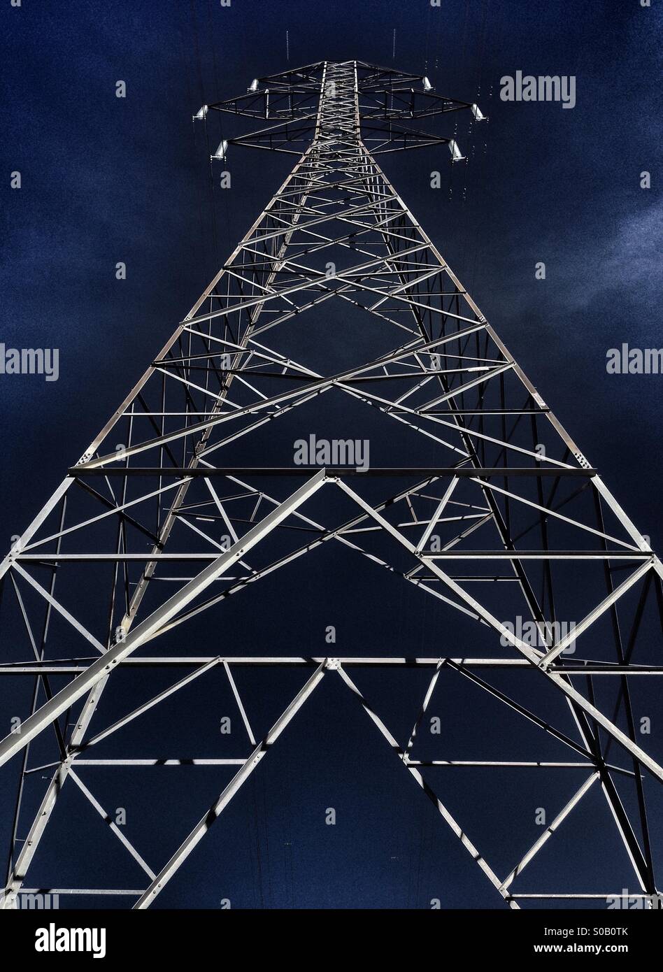 Electricity pylon against a blue sky Stock Photo - Alamy