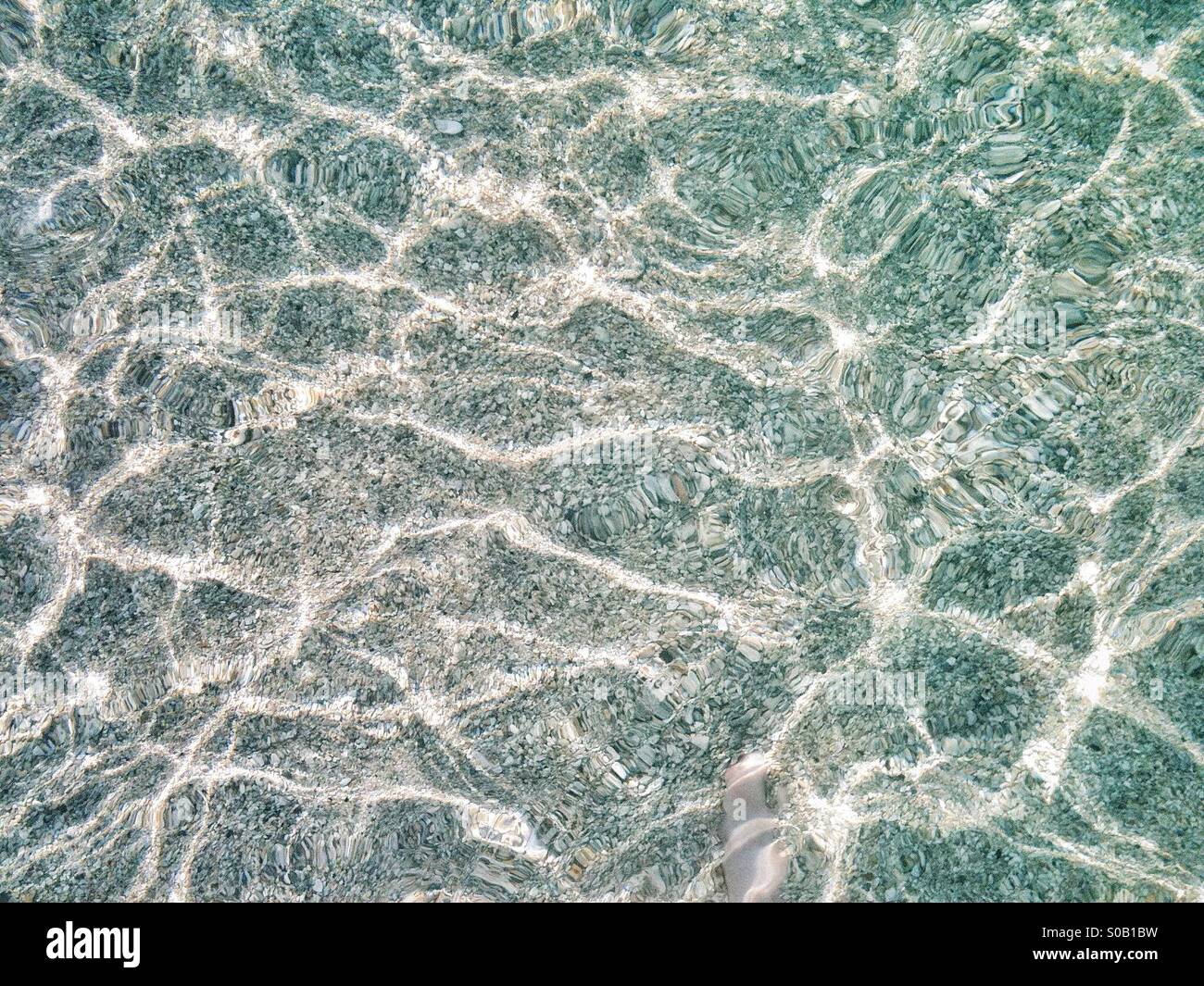 Crystal clear water of Waikiki beach in Hawaii - Smartphone Captured Stock Image