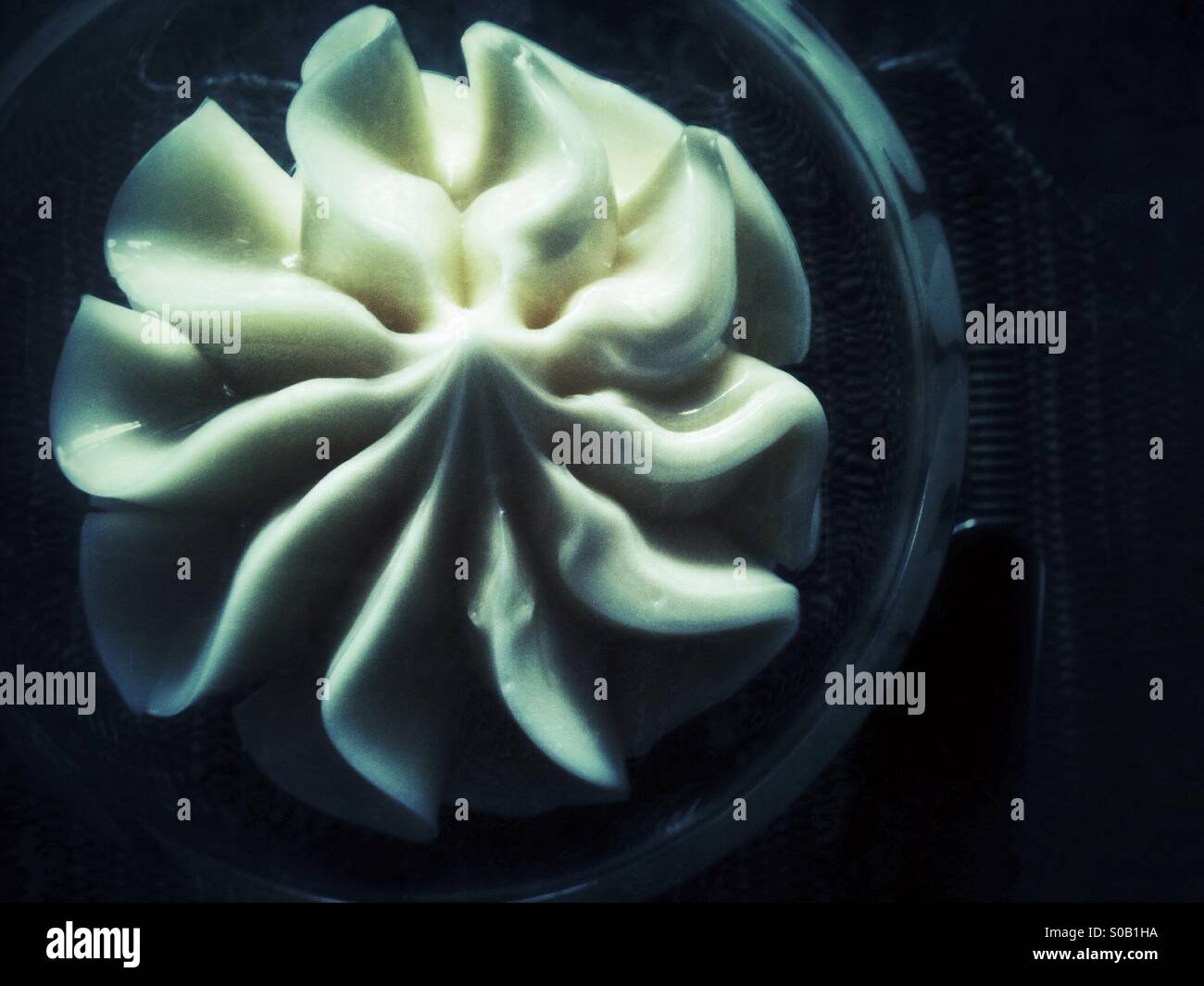 Whipped cream dessert topping in spiral shape - Smartphone Captured Stock Image