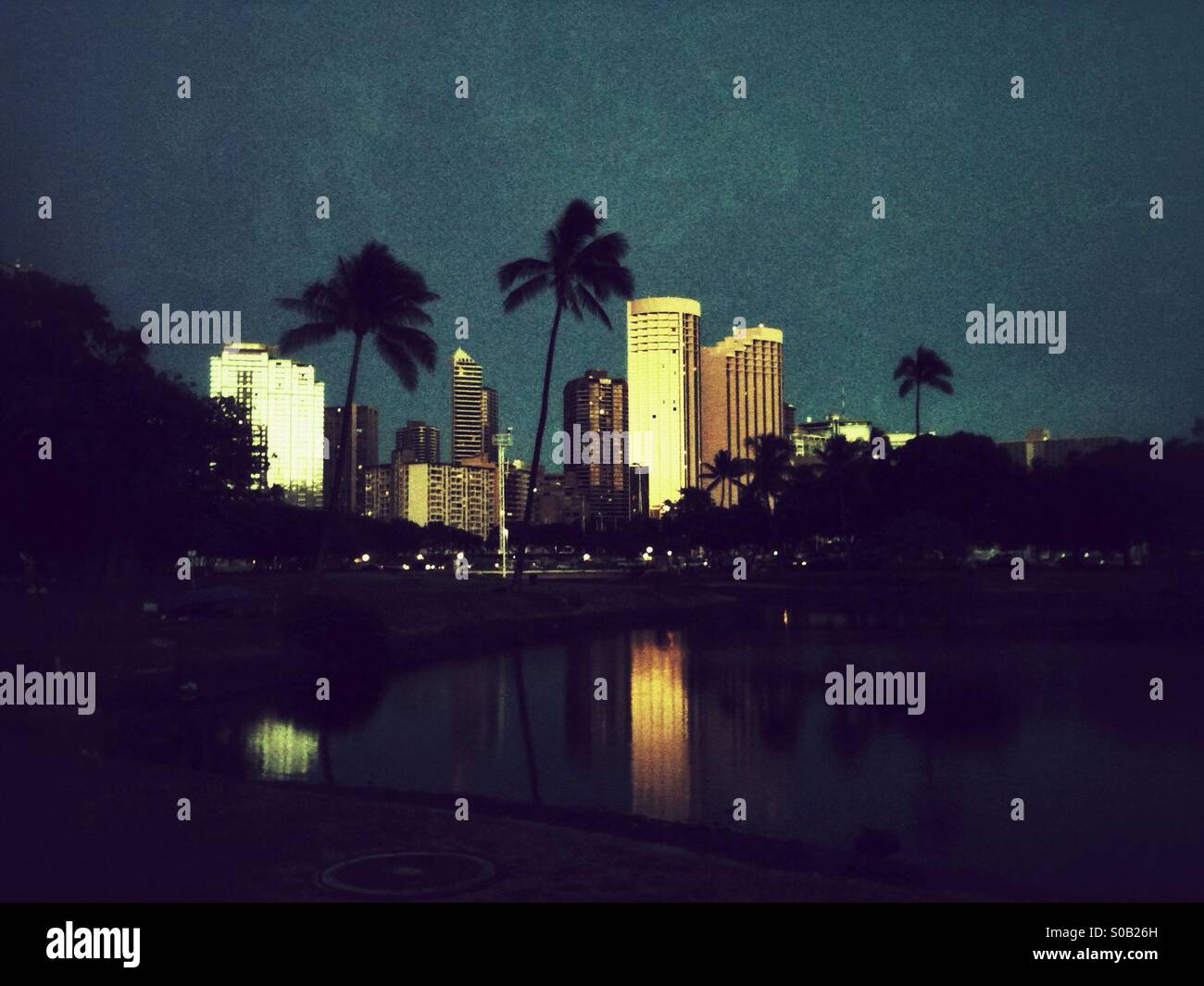 Sunset reflects in high-rise hotels in Honolulu - Smartphone Captured Stock Image