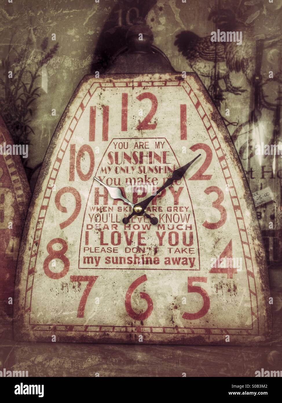 Old clock with words from the song 'You are my Sunshine' on its face. Surrey, England. - Smartphone Captured Stock Image