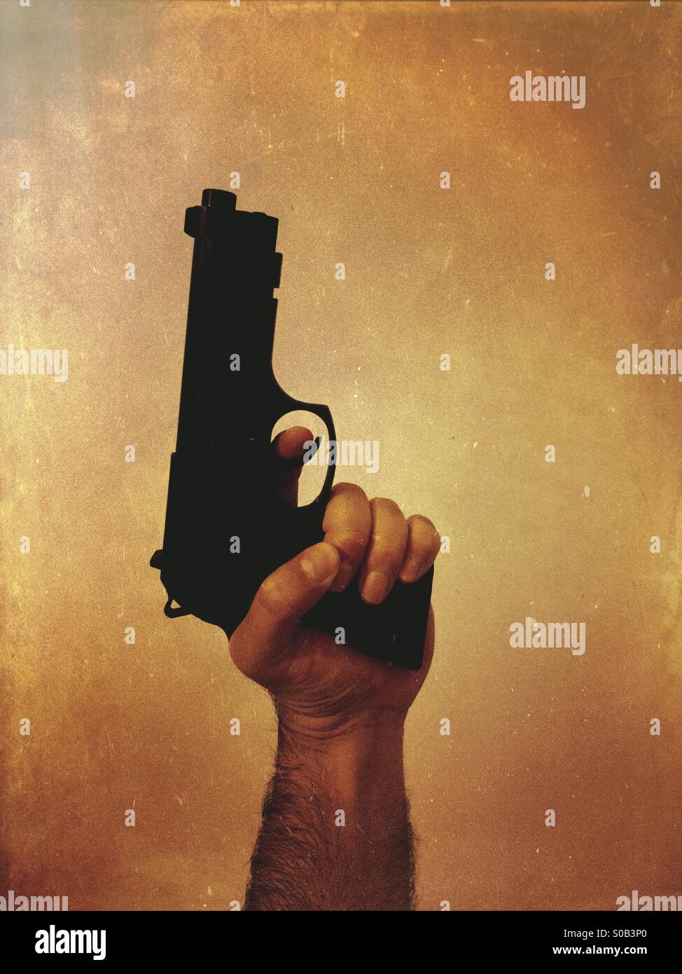 Criminal holding a gun - Smartphone Captured Stock Image