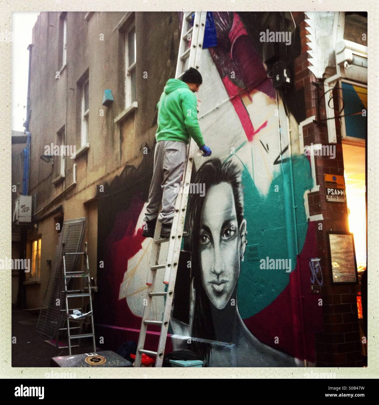 Graffiti artist at work - Smartphone Captured Stock Image