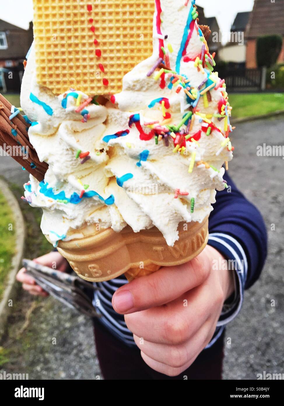 Large Double 99 Mr Whippy ice cream just purchased from a local ice cream man in a van vendor Large Double 99 Mr Whippy ice cream just purchased from a local ice cream man in a van vendor