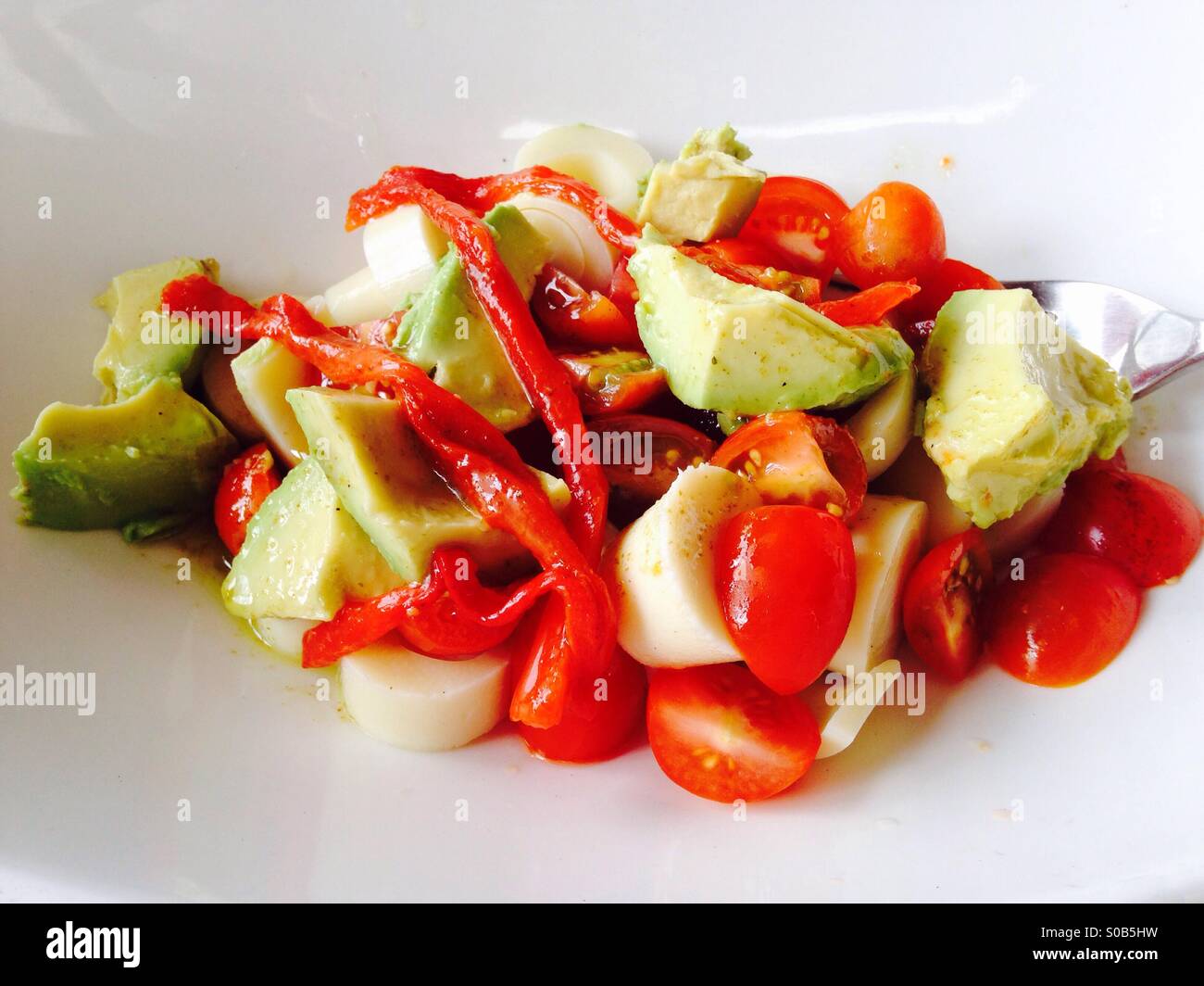 Palm fruit, tomato, avocado and roasted red pepper salad, Costa Rica Stock Photo